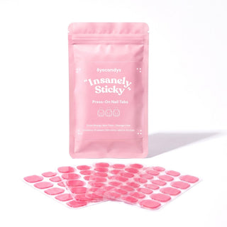 EyeCandys Insanely Sticky Tabs for press on nails with durable adhesive, reusable wear, and salon quality nail application.