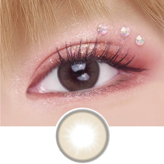 EyeCandys Pink Label Barcelona brown color contact lens on top of a dark eye paired with peach shimmering eye makeup and curled wispy eyelashes, above the contact lens design.