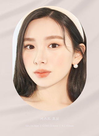 A close-up of a model demonstrating a natural makeup look with Ann365 JUST Choco circle colour contacts, highlighting how well the contact lenses blend with her dark eyes.