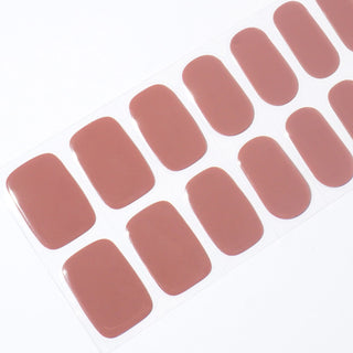 Angled image of semi-cured gel nail stickers in the design 'Macchiato,' featuring a classic nude color brown base for an elegant classic manicure look.