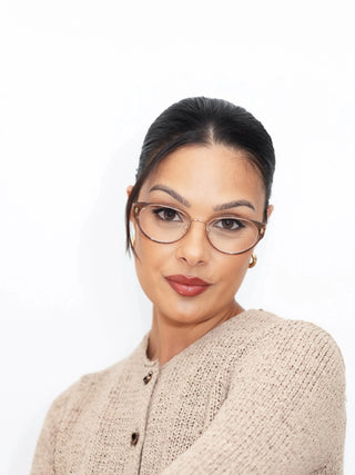 Stylish and functional – Marina wears EyeCandys Bonbon Cat-Eye prescription glasses with Zeiss HMC anti-reflective lenses, blue light blocking, UV-responsive photochromic transitions, and polarized sun lens option. Trendy cat-eye frames for all-day comfort and screen protection.