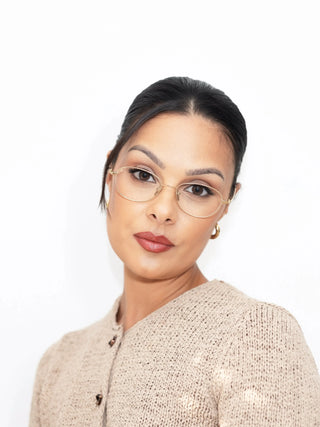 Marina in EyeCandys Zephyr Slim Oval prescription glasses – elegant oval frames with blue light blocking, Zeiss HMC anti-reflective lenses, UV-activated photochromic transitions, and optional polarized sun lenses. Slim, lightweight glasses for screen time, eye protection, and all-day comfort.