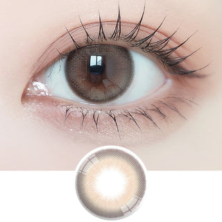 Close-up shot of model's eye adorned with Ann365 Mauve Milk Brown daily color contact lenses with prescription, paired with clean-girl eye makeup, showing the brightening and enlarging effect of the circle contact lens on dark brown eyes, above a cutout of the contact lens with limbal ring on a white background.