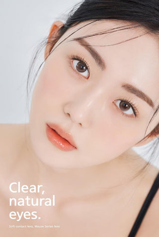 A close-up of a model demonstrating a natural makeup look with Ann365 Mauve Milk Brown circle colour contacts, highlighting how well the contact lenses blend with her dark eyes.