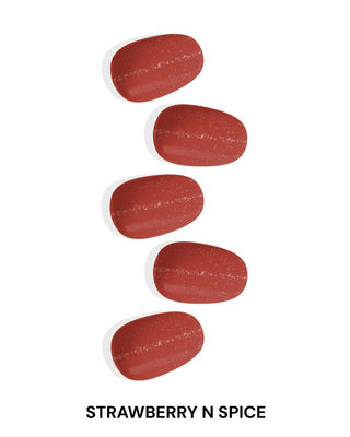 EyeCandys Strawberry Spice Gel Nail Stickers featuring a rich strawberry color and glittery details. Perfect for a vibrant spring nail look that lasts 2-3 weeks. Made with a 7-free, allergy-friendly formula, cures in sunlight without the need for a UV lamp.