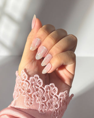 Eyecandys Sugar Cookie Gel Nail Stickers on hand, offering salon-quality nails in 10 minutes with a 7-free, allergy-friendly formula. Lasts 2-3 weeks, cures in sunlight, and strengthens nails