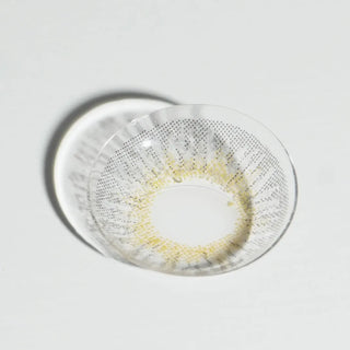 High quality macro shot flatlay of EyeCandys Pink Label New York Grey Contact lens in a plain white backdrop showing the details of the lens