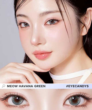 A female model with natural dark eyes wearing Olala Meow Havana Green contact lenses, complemented by subtle eyeshadow and peach lip gloss and Close-up image showcases the model's eyes adorned with the same Green contact lenses