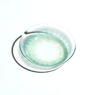 Macro shot of EyeCandys Pink Label Mallorca Blue colored contact lenses – vibrant blue prescription color contact lenses designed for a bold yet natural look.