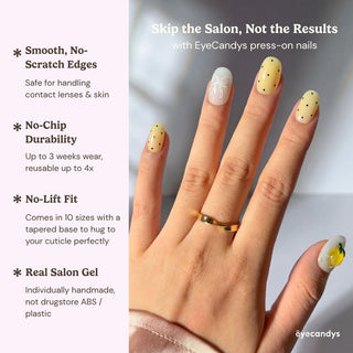Close up hand showcasing Limoncello press on nails with bright pastel yellow color, 3D lemon nail art, and cute bow and polka dot details.