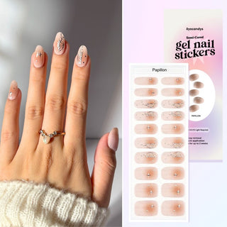Hand with Eyecandys Papillon Gel Nail Stickers, providing a 10-minute application, lasting 2-3 weeks, with a 7-free, allergy-friendly formula that strengthens and repairs nails