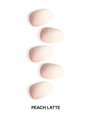 EyeCandys Peach Latte Gel Nail Stickers with a delicate white to peach ombre gradient. Perfect for creating trendy spring nails that last 2-3 weeks with a 7-free, allergy-friendly formula. Cures in sunlight without the need for a UV lamp.