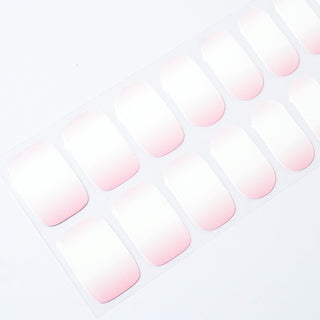 Angled image of semi-cured gel nail stickers in the design 'Pink Candy,' featuring a soft pink gradient with a glossy finish for a delicate and sweet manicure look.