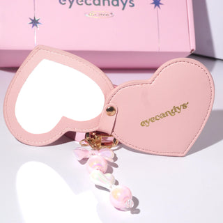 EyeCandys Somethin’ Sweet Mirror Charm – heart-shaped dual-mirror keychain in soft vegan leather with 1x and 2x zoom, kawaii beaded candy charm, and clip for attaching to bags, keys, or belt loops; perfect for stylish on-the-go touch-ups.