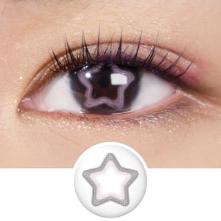 Close-up eye with long lashes wearing EyeCandys Pink Star contact lenses – pastel pink star design pops on dark irises with soft limbal ring for a dreamy, doll-eyed sparkle.