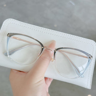 hand holding Eyecandys Posh Prescription Glasses - Blue Light Blocking, Zeiss HMC Coating, Photochromic Transition Lenses, and Polarized Sunglasses