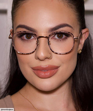 Model wearing the Stunner Square blue light blocking glasses in Pink Tortoiseshell