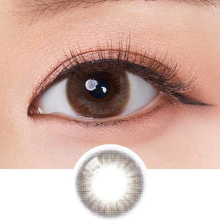 Macro shot of an eye wearing the Olola Swany Pure Choco (KR) colour contact lens, showing the multi-colored detail and natural effect on dark brown eyes, with clean eye makeup