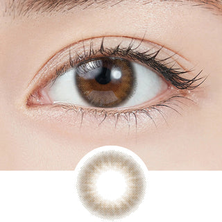 Close-up shot of model's eye adorned with Topards 1-Day Garnet Brown (10pk) daily color contact lenses with prescription, paired with clean-girl eye makeup, showing the brightening and enlarging effect of the circle contact lens on dark brown eyes, above a cutout of the contact lens with limbal ring on a white background.