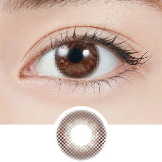 Close-up shot of model's eye adorned with Topards 1-Day Strawberry Quartz (10pk) daily color contact lenses with prescription, paired with clean-girl eye makeup, showing the brightening and enlarging effect of the circle contact lens on dark brown eyes, above a cutout of the contact lens with limbal ring on a white background.