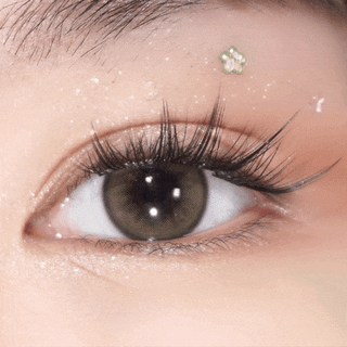 Close-up video of blinking eye with long lashes wearing EyeCandys Pink Label Barcelona Brown – natural-looking prescription colored contact lenses. Soft, comfortable color contact lenses that enhance brown eyes.