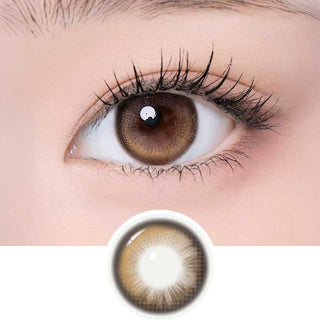 One Pick Becca Azuki color contact lens on top of a dark eye paired with subtle eye makeup and curled wispy eyelashes, above the contact lens design.