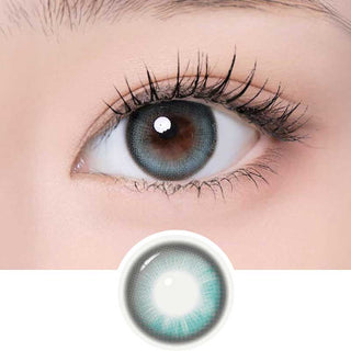 One Pick Becca Matcha color contact lens on top of a dark eye paired with subtle eye makeup and curled wispy eyelashes, above the contact lens design.