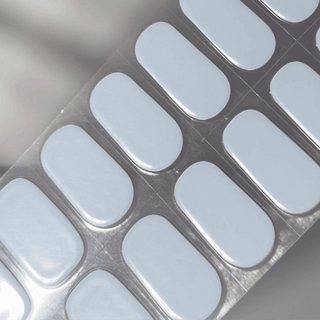 EyeCandys Blueberry Milk Gel nail sticker featuring a soft pastel blue shade inspired by the blueberry milk trend. Delivers a smooth, milky finish with semi-cured gel quality for easy application, long-lasting wear, and a fresh, minimalist look.