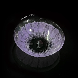 Macro shot of the Shade Purple prescription colored contact lens on a dark background, showing the detailed pattern of the contact lens design