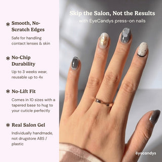 Close up hand showcasing EyeCandys Concrete Poetry press on nails with minimalist neutral tones and sculpted gold accents.