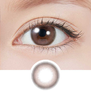 Dark brown eye wearing EyeCandys Cream Rose colored contact lenses, with lens design displayed below – prescription color contact lenses with soft rose tint
