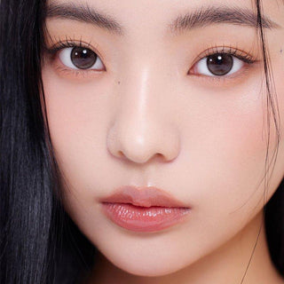 Asian model demonstrating a K-idol-inspired look with Ash Choco daily coloured contact lenses, highlighting the instant brightening and enlarging effect of the circle contact lenses over dark irises.