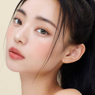 Asian model demonstrating a K-idol-inspired look with Olive Green daily coloured contact lenses, highlighting the instant brightening and enlarging effect of the circle contact lenses over dark irises.