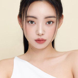Asian model demonstrating a K-idol-inspired look with Olive Green daily coloured contact lenses, highlighting the instant brightening and enlarging effect of the circle contact lenses over dark irises.