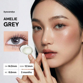 Model with natural makeup wearing EyeCandys Amelie Earl Grey prescription coloured contacts, close-up of eyes, soft and subtle grey tones, enhancing natural look