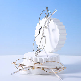 EyeCandys Auden metal frame oval glasses in rose gold. Stylish eyewear with blue light protection, transition-ready lenses, and compatibility with prescription or polarized options