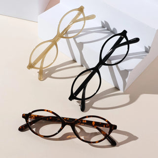 EyeCandys Cassian Full Frame Oval Glasses. Modern unisex eyewear in tortoiseshell, black, and beige, made with lightweight TR material for all-day comfort