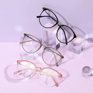 Various colors of the Infinity oversized eyeglass frames, in pink, brown and black, available in blue light blocking lenses and readers, photographed on a purple background, from EyeCandys