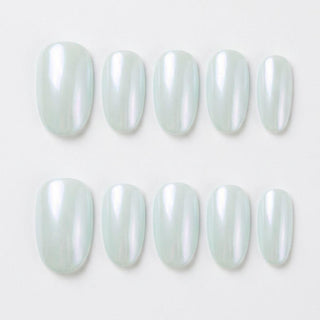 Close-up of Eyecandys Peritinkle reusable press-on nails showcasing a glossy periwinkle chrome finish with cool blue, mint, and icy shimmer.