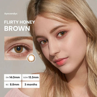 Brown-haired model wearing EyeCandys Pink Label Flirty Honey Brown lenses with peach eyeshadow – includes eye close-up with lens detail