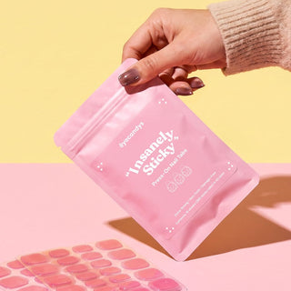 EyeCandys Insanely Sticky Tabs for press on nails with durable adhesive, reusable wear, and salon quality nail application.