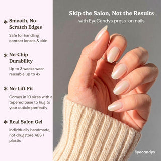 Detailed view of Eyecandys Soft Serve press-on nails highlighting a reflective pearl white chrome finish, pearlescent glow, and creamy glazed manicure.