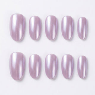 Close-up of Eyecandys Taro Latte reusable press-on nails showcasing a glossy milky lavender chrome finish with a luminous pearlescent glow.