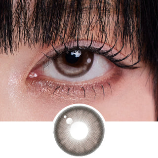 Close-up shot of model's eye adorned with Grace Chocolate prescription circle contact lenses, complemented by clean eye makeup, showing the brightening effect of the prescription cosmetic contact lens on dark brown eyes.