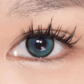 Video of eye blinking with long lashes wearing EyeCandys Powerglow Green contact lens — striking green color with intense pigmentation and defined limbal ring. Perfect for cosplay and fantasy looks, featuring UV protection and moisture-retaining MPC polymer for comfort and clarity
