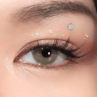 Blinking eye wearing EyeCandys Pink Label Mykonos Brown – soft brown prescription colored contact lenses. Natural color contact lenses that blend seamlessly for a subtle enhancement.