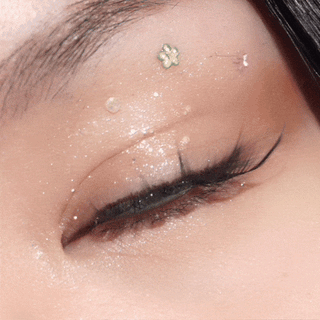 Close-up video of blinking eye with long lashes wearing EyeCandys Pink Label Mykonos Grey – elegant grey prescription colored contact lenses. Stylish and comfortable color contact lenses for a subtle eye transformation.