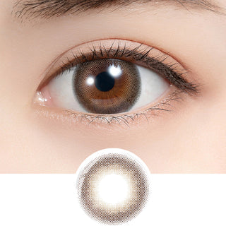 Close-up shot of model's eye adorned with Feliamo 1-Day Affogato (10pk) daily color contact lenses with prescription, paired with clean-girl eye makeup, showing the brightening and enlarging effect of the circle contact lens on dark brown eyes, above a cutout of the contact lens with limbal ring on a white background.