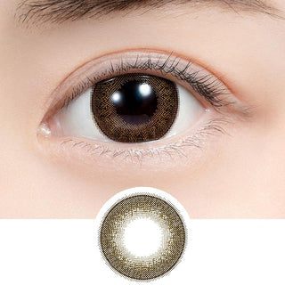 Close-up shot of model's eye adorned with Feliamo 1-Day Chestnut (10pk) daily color contact lenses with prescription, paired with clean-girl eye makeup, showing the brightening and enlarging effect of the circle contact lens on dark brown eyes, above a cutout of the contact lens with limbal ring on a white background.