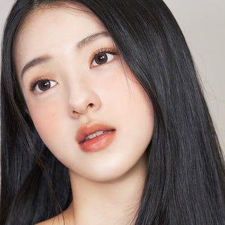 Asian model demonstrating a K-idol-inspired look with 1-Day Brown coloured contact lenses, highlighting the instant brightening and enlarging effect of the circle contact lenses over dark irises.
